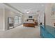 Bright main bedroom featuring tray ceiling, large window, and cozy decor at 5213 Orabelle Ct, Raleigh, NC 27606