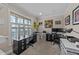 Well-lit home office with ample desk space, large window, and neutral decor at 5213 Orabelle Ct, Raleigh, NC 27606