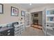 Well-lit home office with ample desk space, large window, and neutral decor at 5213 Orabelle Ct, Raleigh, NC 27606