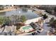 A captivating aerial view shows a community pool, sandy beach, and pond at 5213 Orabelle Ct, Raleigh, NC 27606