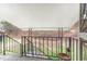View of back porch with wrought iron railing and stairs to the wooded area at 529 Hillsborough # H-6, Chapel Hill, NC 27514