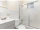 Bright bathroom featuring a shower and tub combination with sliding glass doors at 529 Hillsborough # H-6, Chapel Hill, NC 27514