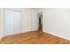 Bedroom with hardwood flooring and large closet providing ample storage space at 529 Hillsborough # H-6, Chapel Hill, NC 27514