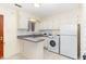 Bright kitchen with white cabinets and appliances at 529 Hillsborough # H-6, Chapel Hill, NC 27514