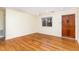 Cozy living room featuring gleaming hardwood floors, white trim, and natural light at 529 Hillsborough # H-6, Chapel Hill, NC 27514