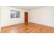 Inviting living room featuring hardwood floors and a wood-stained front door at 529 Hillsborough # H-6, Chapel Hill, NC 27514