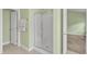 Bathroom featuring tiled floors, shower stall and neutral paint at 6013 Kohler Ln, Raleigh, NC 27616