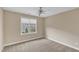 Neutral bedroom with carpet, a window and a ceiling fan with lights at 6013 Kohler Ln, Raleigh, NC 27616