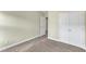 A secondary bedroom features wall-to-wall carpet and closet at 6013 Kohler Ln, Raleigh, NC 27616