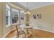 Sunlit breakfast nook with a round table and bay window offering a pleasant view at 6013 Kohler Ln, Raleigh, NC 27616