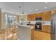 Bright kitchen boasts stainless steel appliances, light wood cabinets, and adjacent breakfast nook at 6013 Kohler Ln, Raleigh, NC 27616