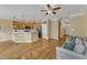 Open-concept living space with hardwood floors, a kitchen bar, and a comfortable seating area at 6013 Kohler Ln, Raleigh, NC 27616