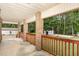 Covered back porch with brick columns and a view of the backyard at 604 S Chavis St, Franklinton, NC 27525