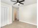 Cozy bedroom features neutral carpeting and a closet; door opens to the hallway at 604 S Chavis St, Franklinton, NC 27525