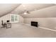 Large bonus room offering a great space with neutral walls and carpet; ceiling fan included at 604 S Chavis St, Franklinton, NC 27525