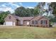 Charming single-story brick home with attached garage, landscaped yard, and classic architectural details at 604 S Chavis St, Franklinton, NC 27525