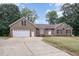 Charming brick home with a well-manicured lawn and a spacious driveway at 604 S Chavis St, Franklinton, NC 27525