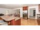 Gourmet kitchen with granite countertops, stainless steel appliances, and views of the living spaces at 604 S Chavis St, Franklinton, NC 27525