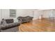 Inviting living room with hardwood floors, decorative seating, and natural light from the windows at 604 S Chavis St, Franklinton, NC 27525