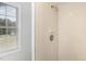 A tiled shower offers a clean and functional space for your daily routine at 604 S Chavis St, Franklinton, NC 27525