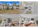 Neutral-colored townhouse complex showcasing mature landscaping, visible unit numbers, and accessible walkways at 612 Pine Ridge Pl, Raleigh, NC 27609