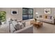 Living room with neutral tones, stylish furniture, a balcony and bright, natural light at 612 Pine Ridge Pl, Raleigh, NC 27609