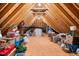 Spacious unfinished attic storage with exposed rafters, ideal for storing belongings at 7001 Millstone Ridge Ct, Raleigh, NC 27614
