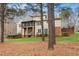 Large backyard with screened in porch provides the perfect outdoor retreat for relaxation at 7001 Millstone Ridge Ct, Raleigh, NC 27614