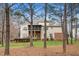 Spacious backyard with mature trees, a screened-in porch, and plenty of room for recreation at 7001 Millstone Ridge Ct, Raleigh, NC 27614
