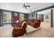 Finished basement home theater featuring tiered seating and projector, perfect for entertainment at 7001 Millstone Ridge Ct, Raleigh, NC 27614