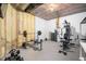 Unfinished basement features a gym area with a weight bench and workout equipment at 7001 Millstone Ridge Ct, Raleigh, NC 27614
