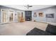 Spacious basement with fireplace, bar table, walkout door and a fun putting green for entertainment at 7001 Millstone Ridge Ct, Raleigh, NC 27614