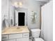 Bright bathroom with a large mirror, single vanity, and a shower with a white curtain at 7001 Millstone Ridge Ct, Raleigh, NC 27614
