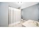 Bathroom featuring a tile shower, neutral walls, and modern fixtures throughout at 7001 Millstone Ridge Ct, Raleigh, NC 27614