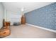 Bright bedroom with patterned wallpaper, hardwood furniture, and a comfy grey beanbag at 7001 Millstone Ridge Ct, Raleigh, NC 27614