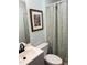 Bright bathroom featuring blue accent wall and a decorative floral shower curtain at 704 Martin Luther King Jr Blvd # D12, Chapel Hill, NC 27514