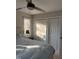 Sunlit bedroom featuring two closets, light colored wooden furniture, and a ceiling fan at 704 Martin Luther King Jr Blvd # D12, Chapel Hill, NC 27514