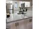 Modern kitchen featuring granite countertops, stainless steel appliances, and white cabinets at 704 Martin Luther King Jr Blvd # D12, Chapel Hill, NC 27514