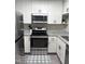 A beautifully renovated kitchen featuring white cabinets, stainless steel appliances, and granite countertops at 704 Martin Luther King Jr Blvd # D12, Chapel Hill, NC 27514