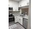 Updated kitchen features stainless steel appliances, ample counter space, and sleek white cabinets at 704 Martin Luther King Jr Blvd # D12, Chapel Hill, NC 27514