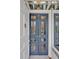 Stylish blue double doors with glass panes create an inviting entryway at 712 Tarleton Ave, Burlington, NC 27215