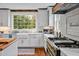 Charming kitchen featuring an apron sink, stainless steel appliances, and wood countertops at 712 Tarleton Ave, Burlington, NC 27215