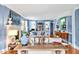 Bright living room with blue walls, fireplace, and elegant furnishings at 712 Tarleton Ave, Burlington, NC 27215
