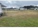 Large backyard, view of surrounding houses and greenery at 804 S Sampson Ave, Dunn, NC 28334