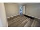 Cozy bedroom with modern luxury vinyl plank flooring and neutral walls at 804 S Sampson Ave, Dunn, NC 28334