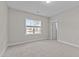 Bright bedroom with neutral walls, carpet and a window bringing in natural light at 8816 Knights Union Way, Wake Forest, NC 27587
