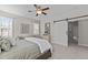 Bright bedroom with white trim, carpeted floor, and a white sliding barn door to bathroom at 8816 Knights Union Way, Wake Forest, NC 27587