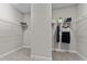 Walk-in closet with carpet and white wire shelving on both sides for maximum storage at 8816 Knights Union Way, Wake Forest, NC 27587