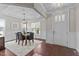 Bright dining room featuring a modern table set, stylish decor, and a large door with natural light at 8816 Knights Union Way, Wake Forest, NC 27587