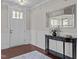Foyer features a decorative table, elegant mirror, and stylish lighting at 8816 Knights Union Way, Wake Forest, NC 27587